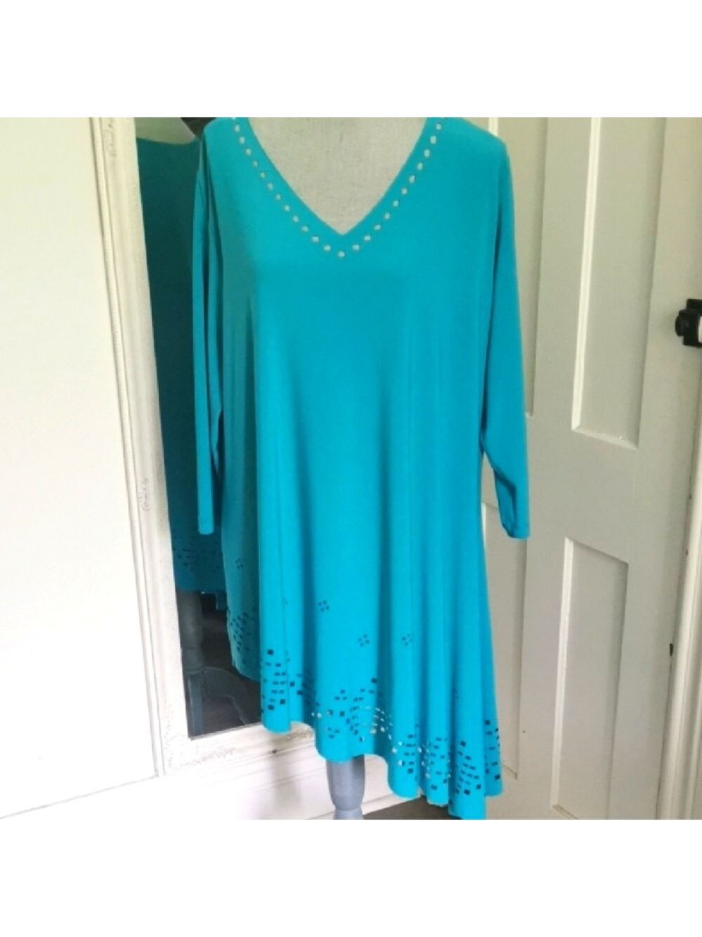Sympli deco tunic top laser cutout teal blue asymmetrical flare. Size 18 . EUC